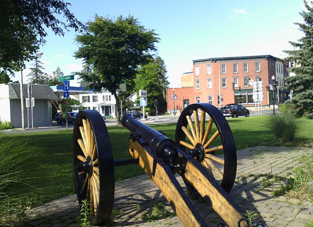 A canon in a park overlooking to town of Schoharie County