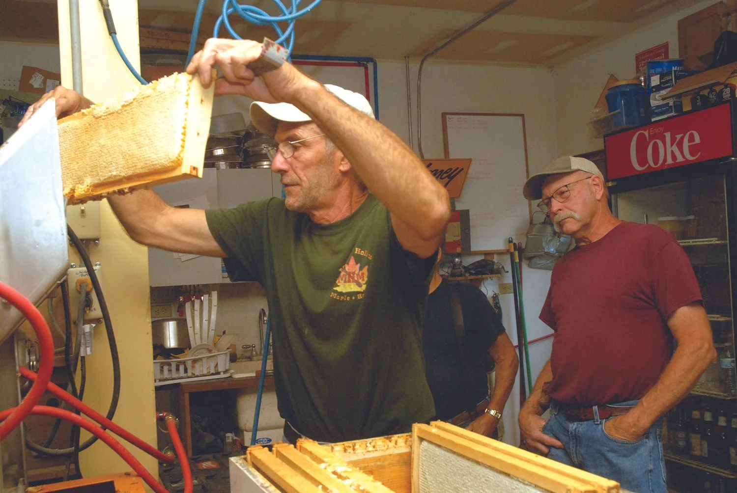 Farmers Market vendor Dean Haskin with honey comb