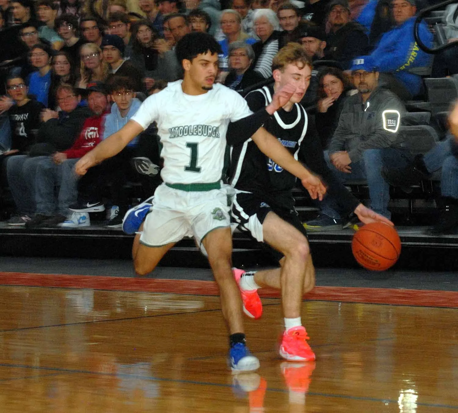 Two kids playing basketball at their Upstate New York Schoool