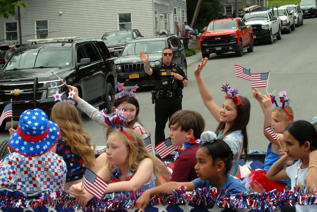 RVD. Radez kids cop in background.jpg