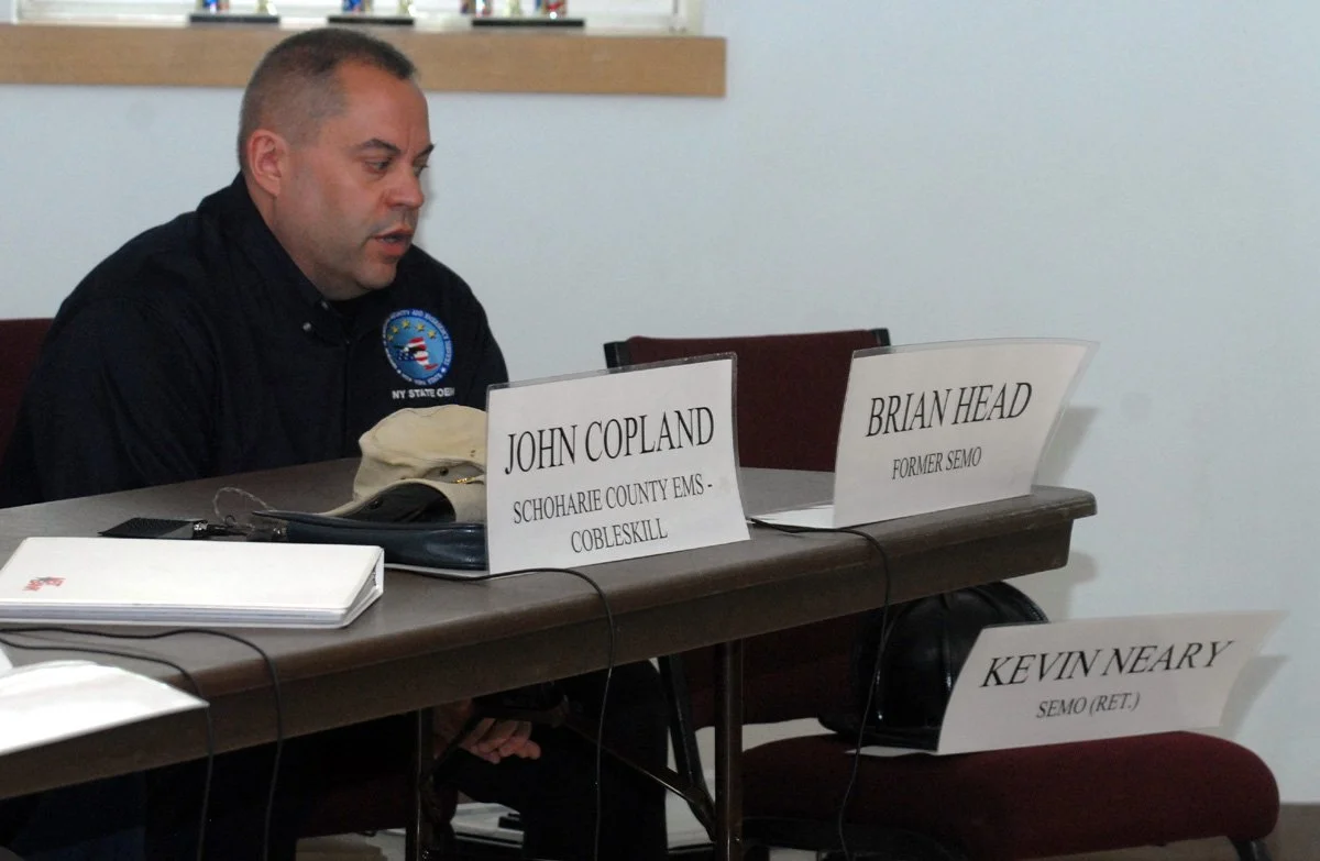 9.11.Brian behind signs.jpg