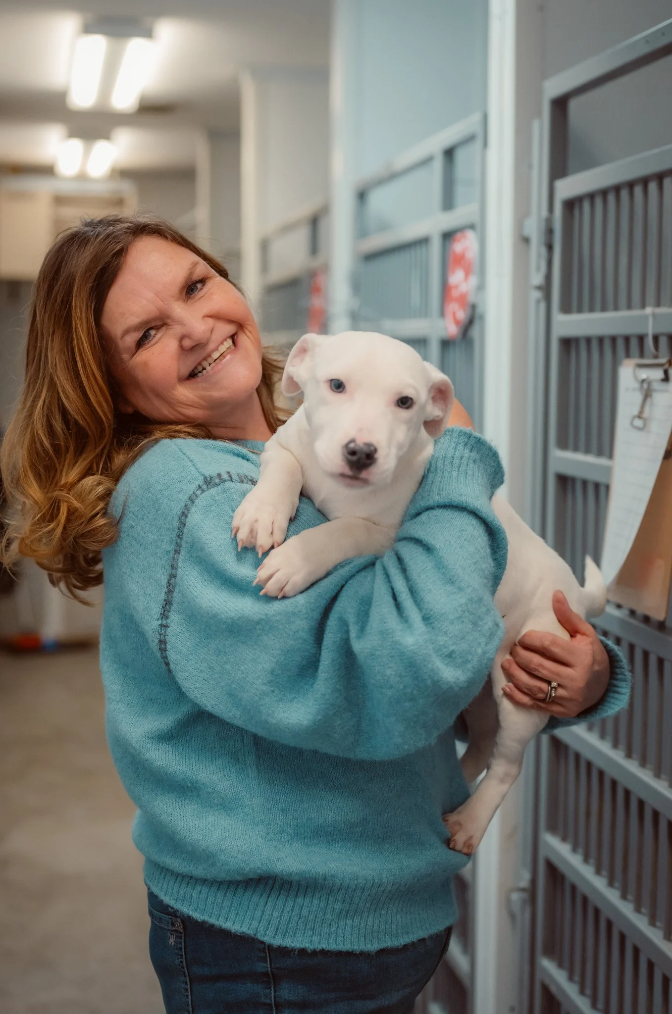 Woman with a dog at the Schoharie County Humane Society in New York