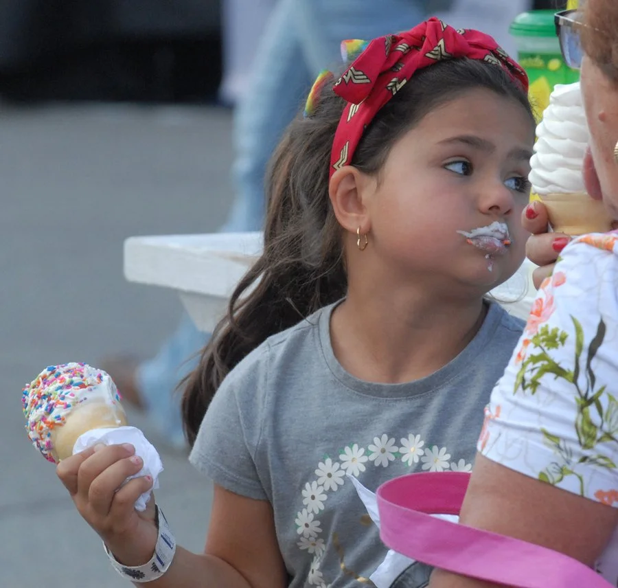 A girl covered in ice cream at the Sushine Fair