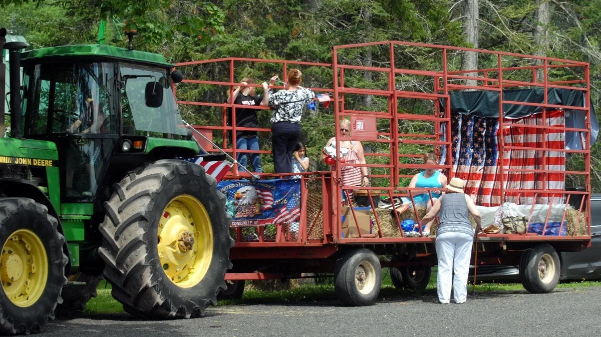 Gilboa residents decorate a wagon in bunting and American flags.