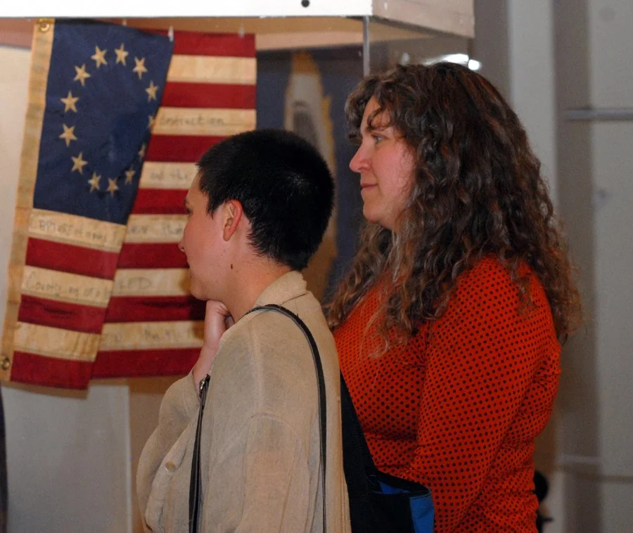 People look at Iroquois Museum artwork at opening reception.