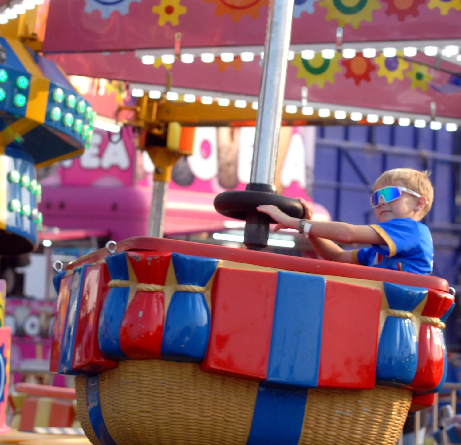A boy on a midway ride