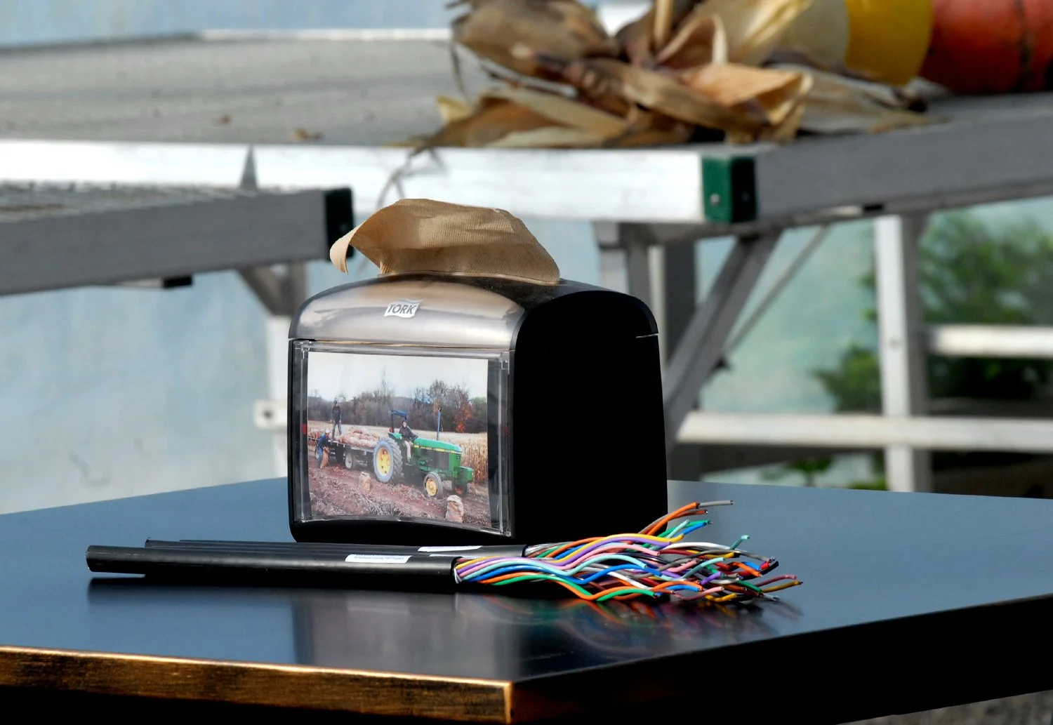 Broadband fiber on a table in front of a tractor photo at Schoharie Valley Farms.
