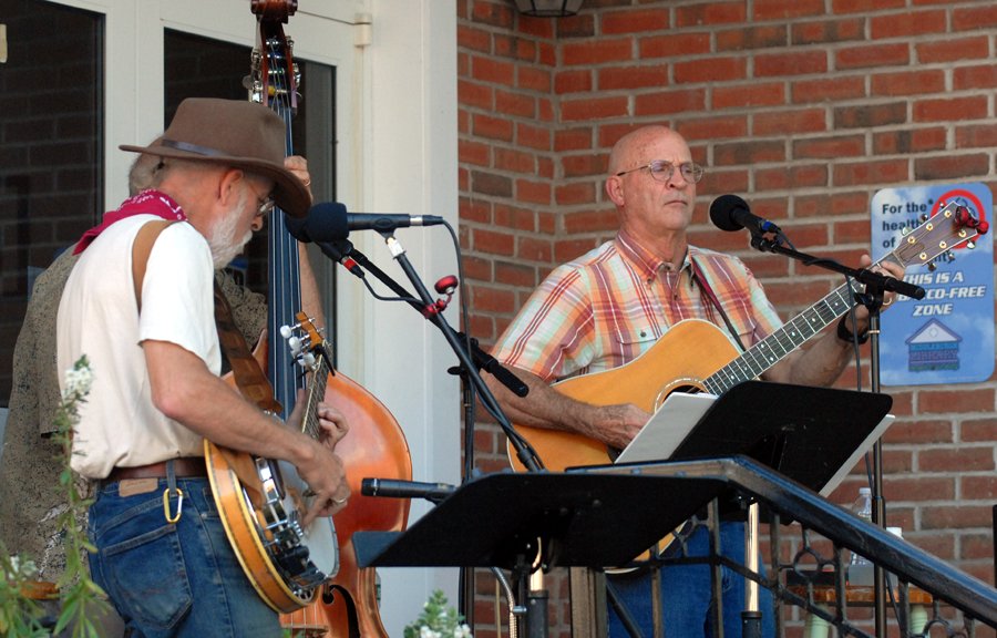 A local band performs outside tne Middleburgh Library during an August 4th Friday.