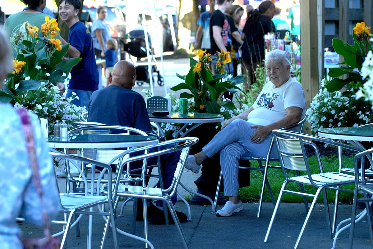 A couple sits at a table outside Hubie's Restaurant in  Middleburgh, NY