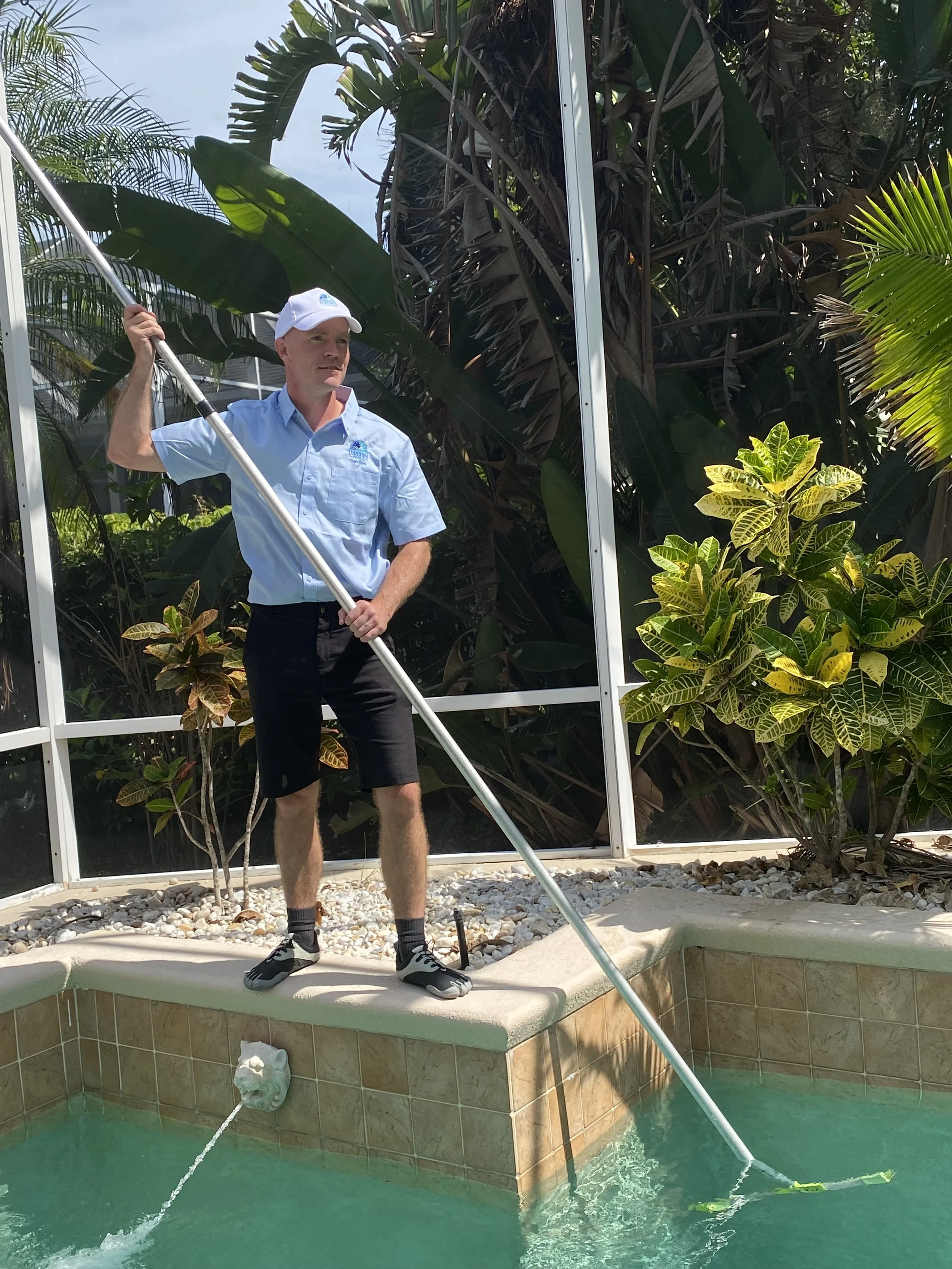 Man Brushing Pool, Man Cleaning Pool