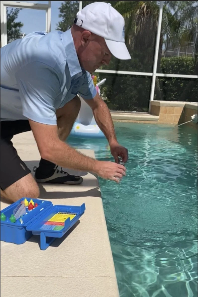 Man testing pool chemicals