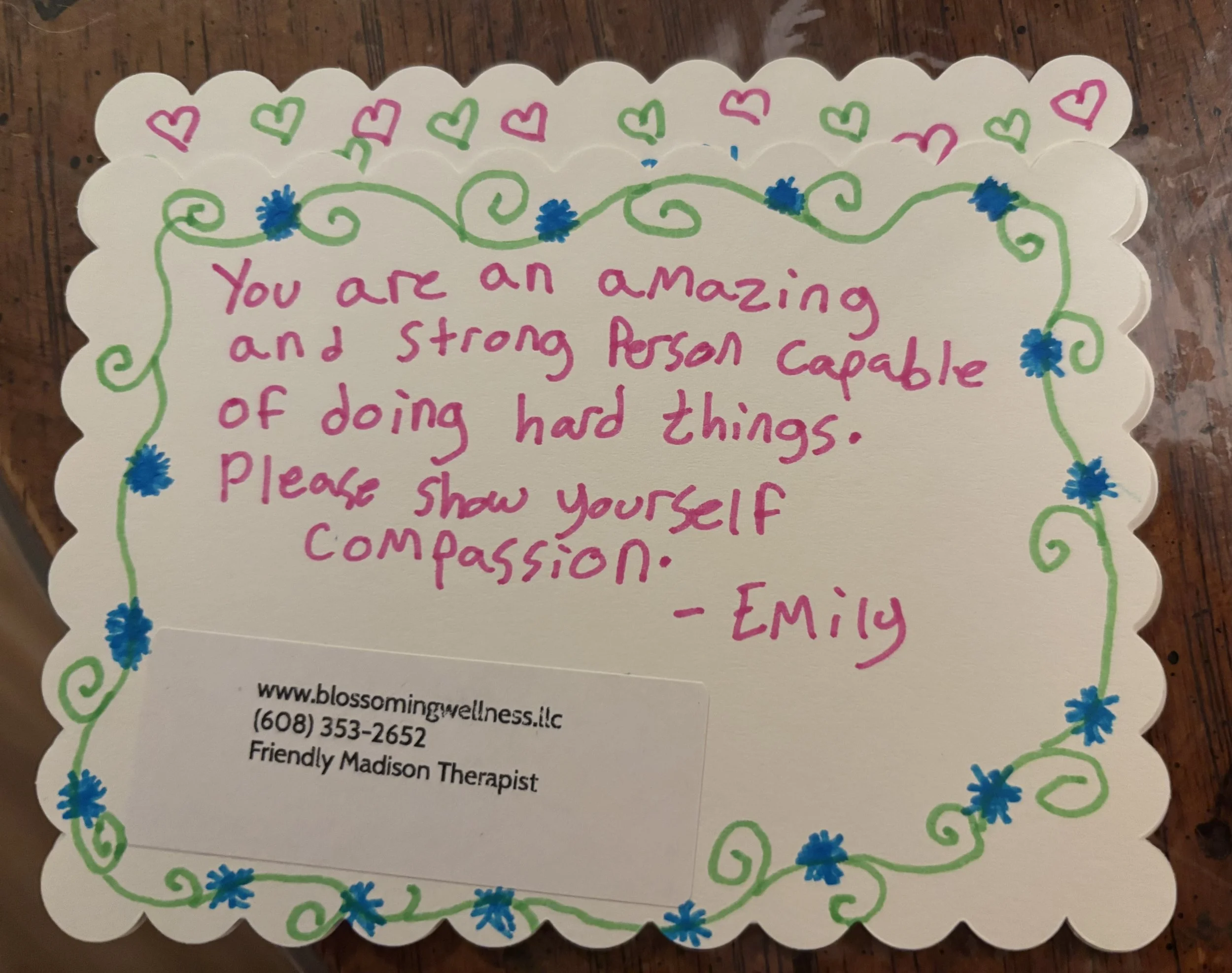 Colorful greeting card with a floral border and inspirational message.