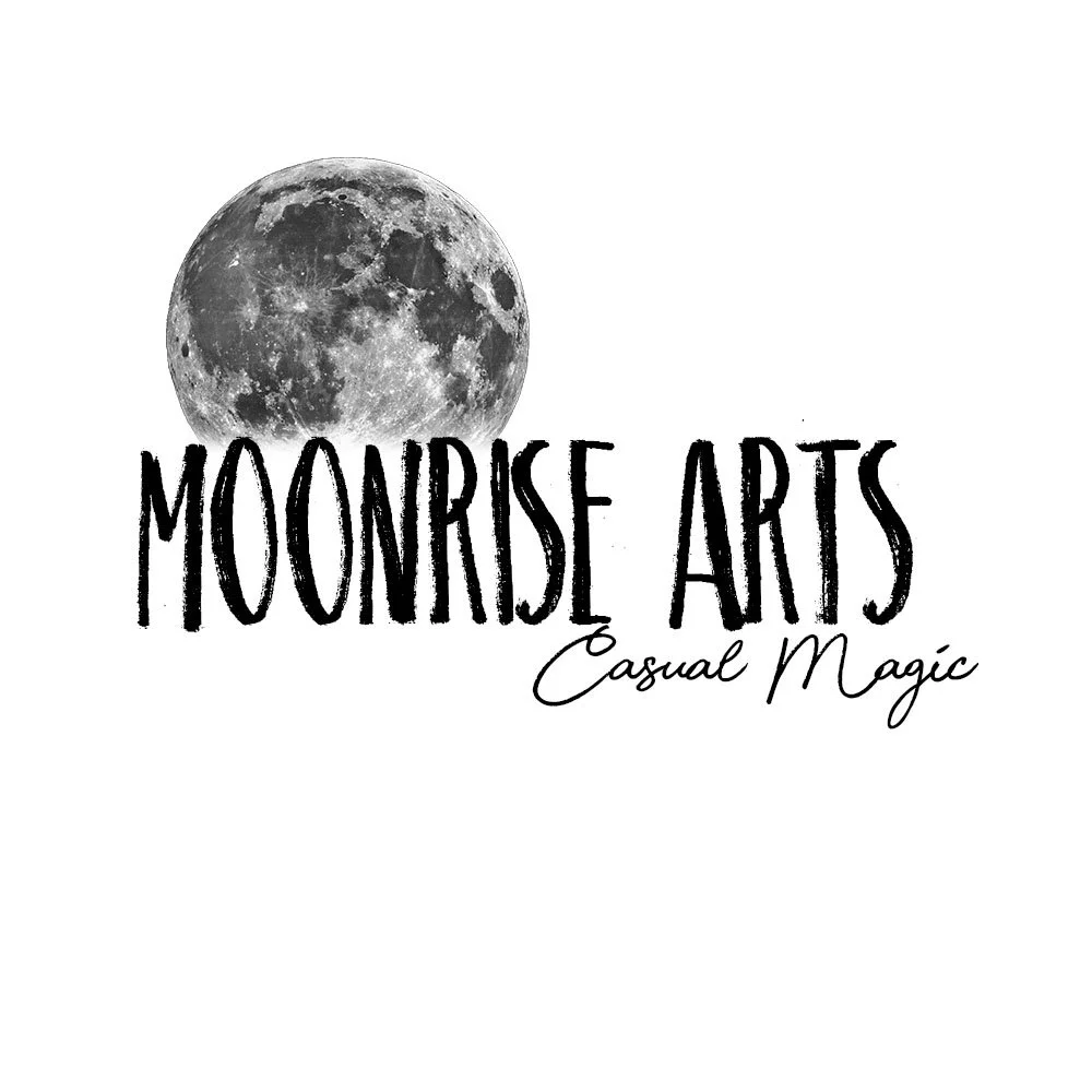 Logo with a full moon above the text 'Moonrise Arts' and the tagline 'Casual Magic' written in script.