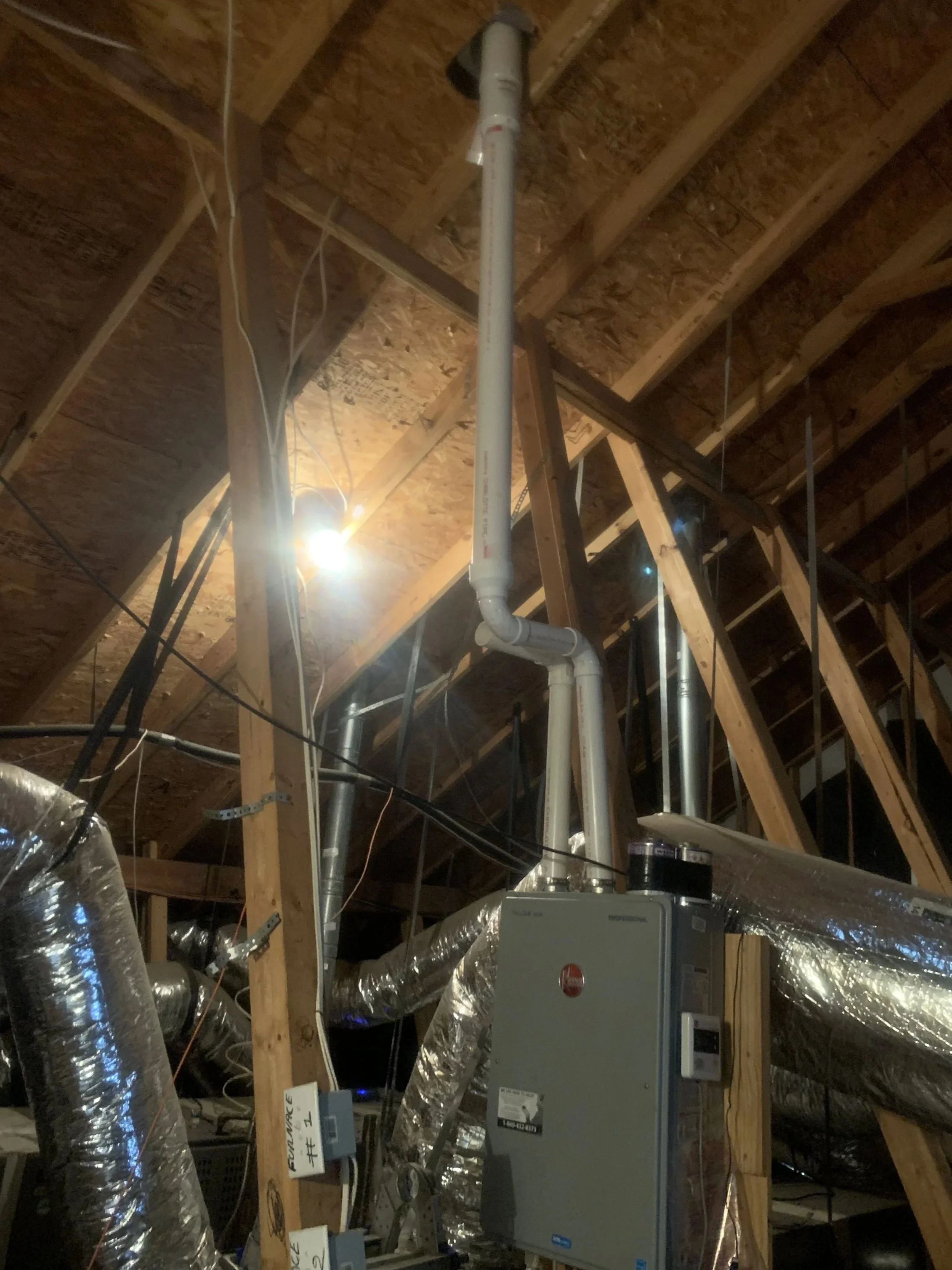 Tankless water heater installation in residental attic - No Pressure Plumbing