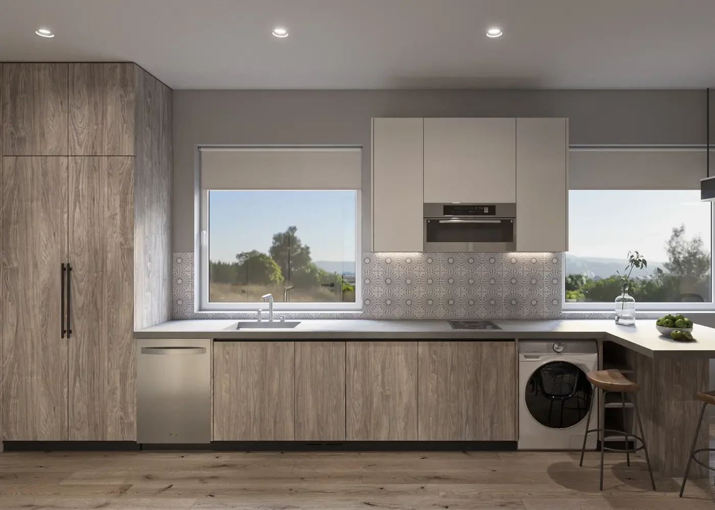 Modern ADU kitchen design with light wood cabinetry, large windows and integrated laundry