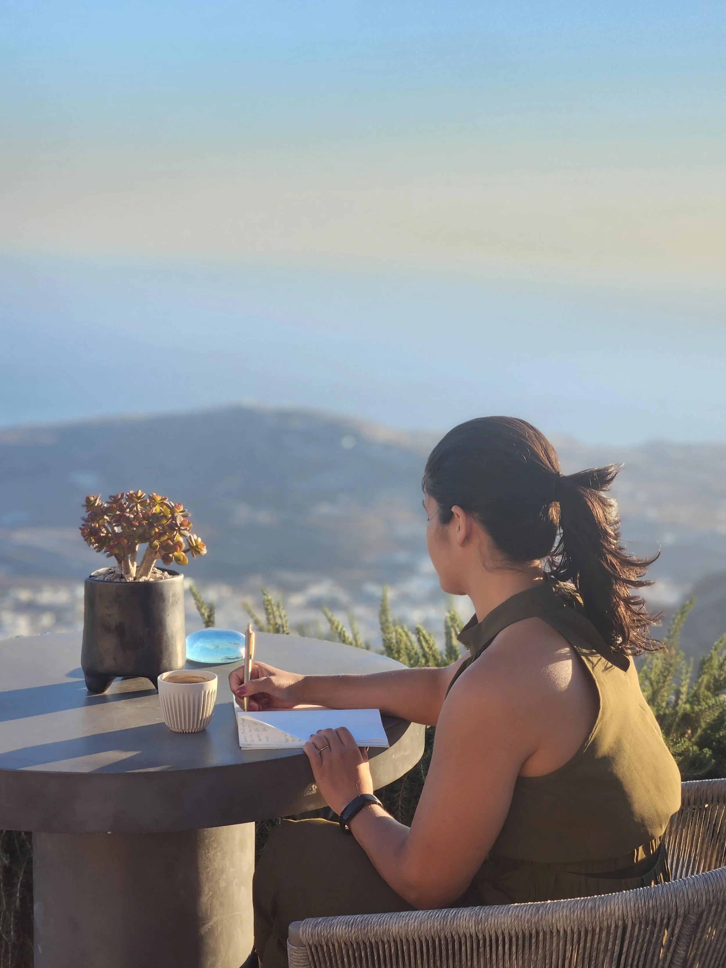 Woman reflecting on finances and mental health, representing financial therapy support