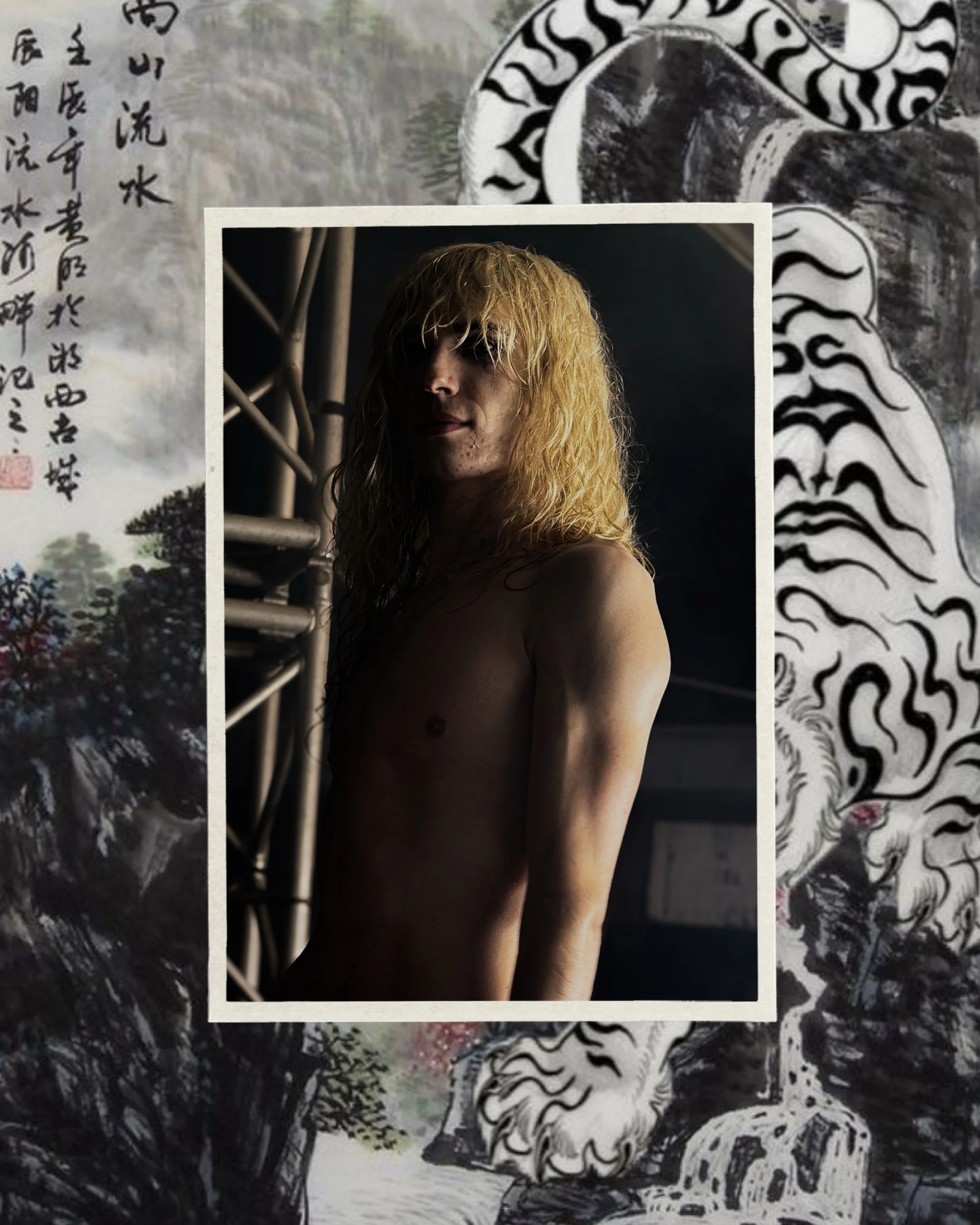 A shirtless man with long, blonde, curly hair standing in a dimly lit room with a dark background, partially framed by a white border, amidst traditional Asian art with dragon illustrations and calligraphy.
