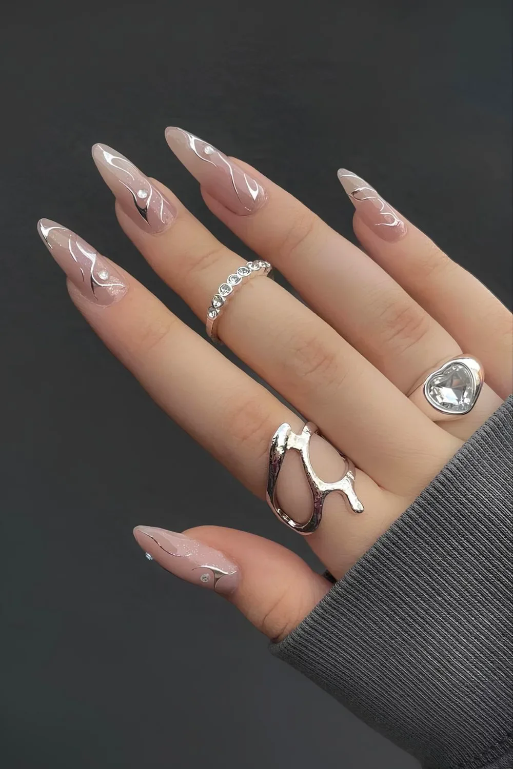 Nude-nails-with-rhinestones-and-silver-chrome-accents.jpg.webp