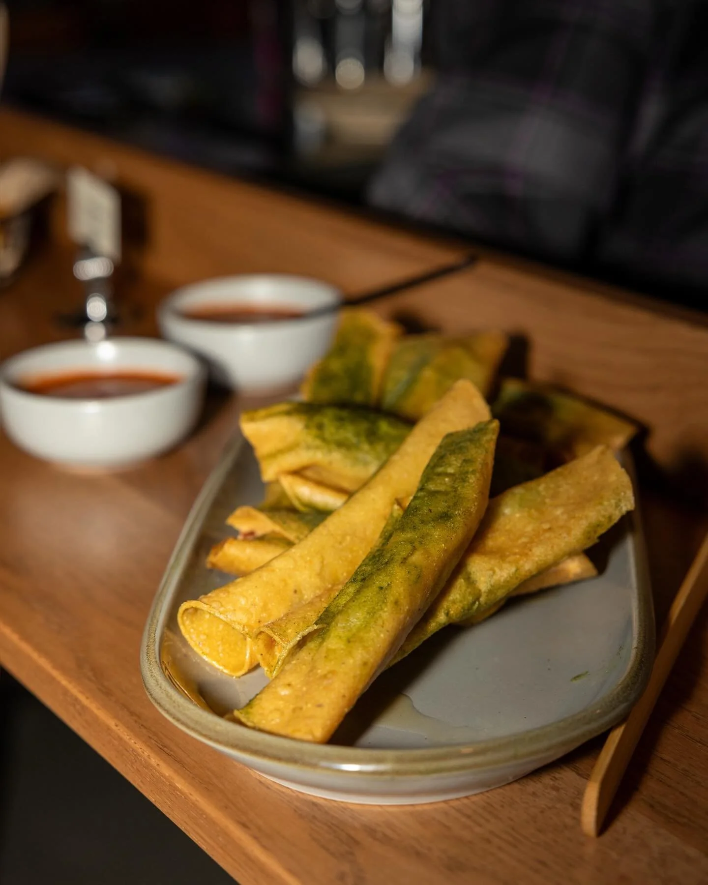 Open 11am Saturday &amp; Sunday 🌞  Rolled tacos filled with potato &amp; charred green onion, then deep fried and dusted with sour cream &amp; onion seasoning. Served with creamy Salsa Verde. 

#kansascity #crossroadskc #kcevents #kclocal #kcfoodie