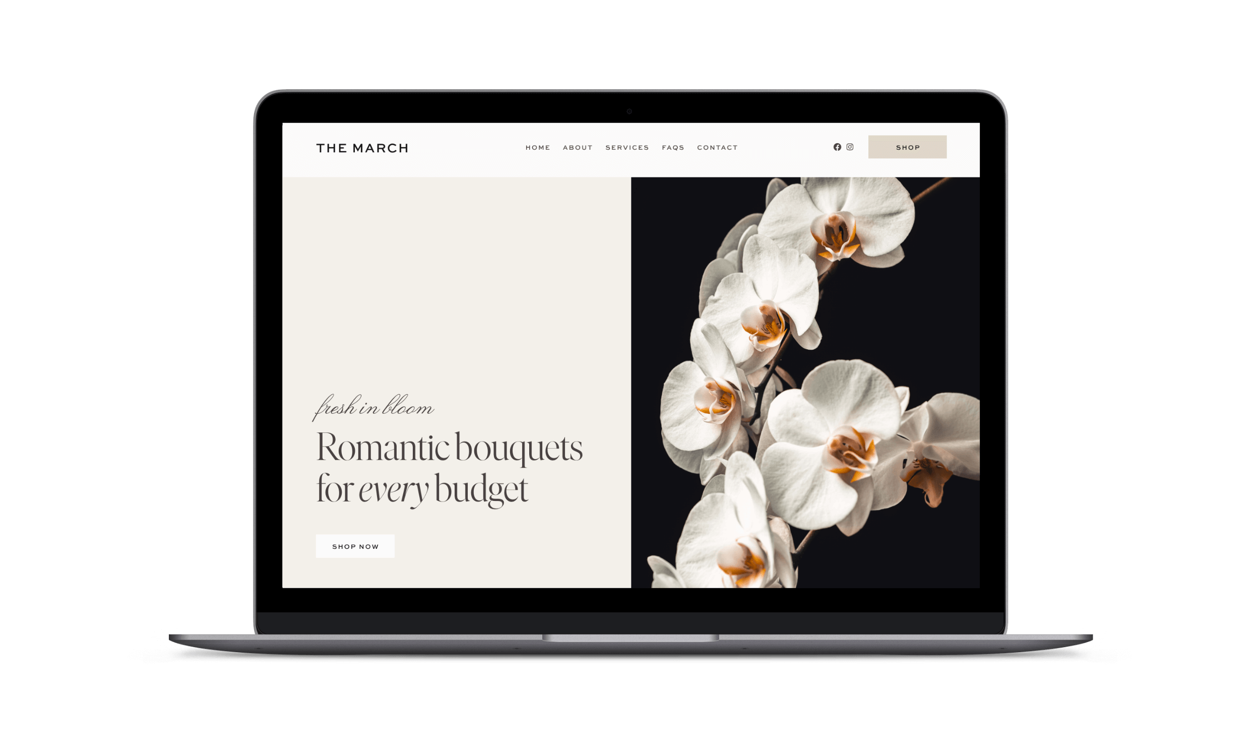 Laptop displaying a floral website with white orchids on a dark background.