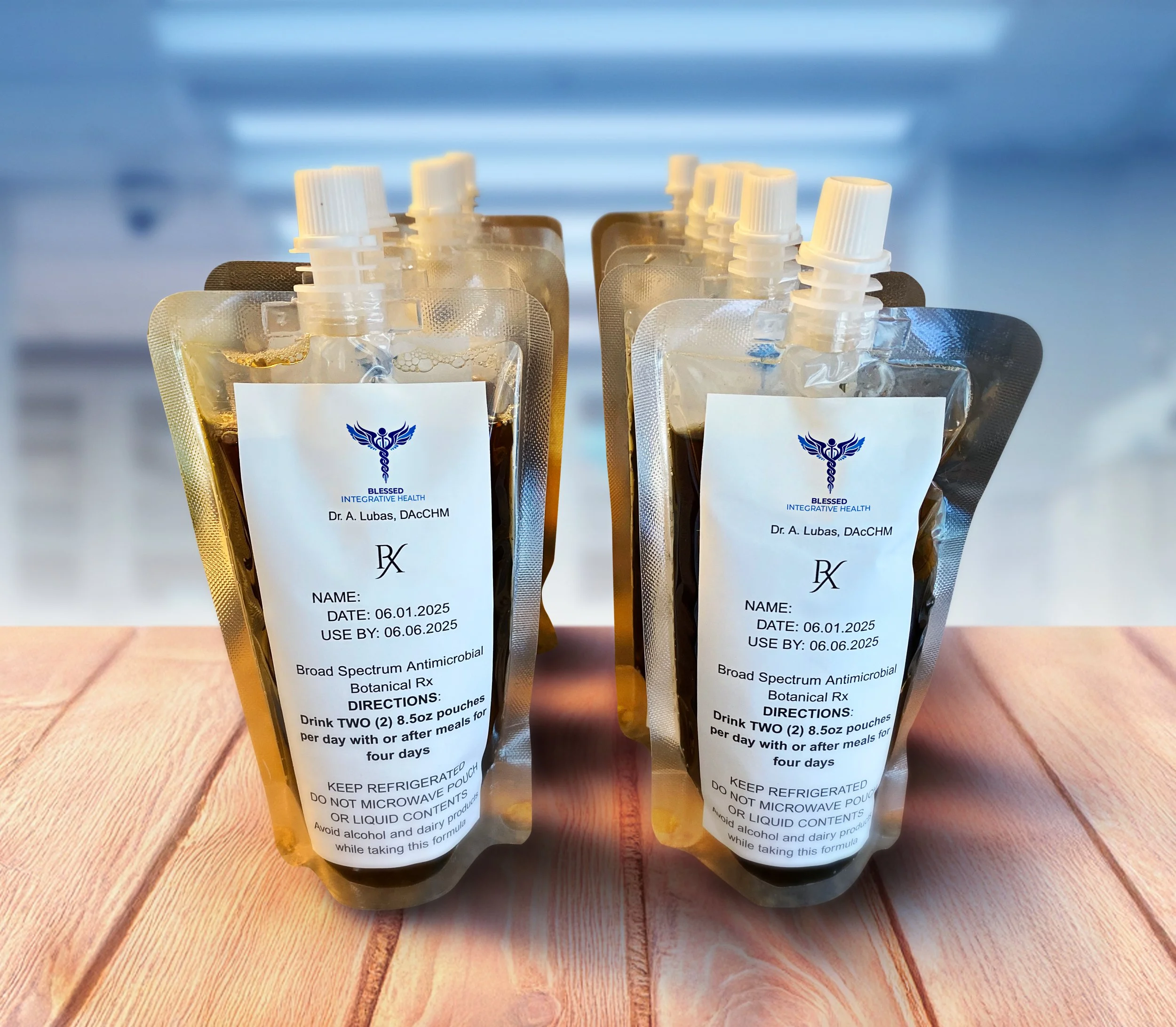 A photograph of Blessed Integrative Health prescription 8.5 oz herbal decoction as packaged for shipping/delivery in safety sealed pourable pouches. Prescription labels document doctor’s name, prescription date, and directions for use.