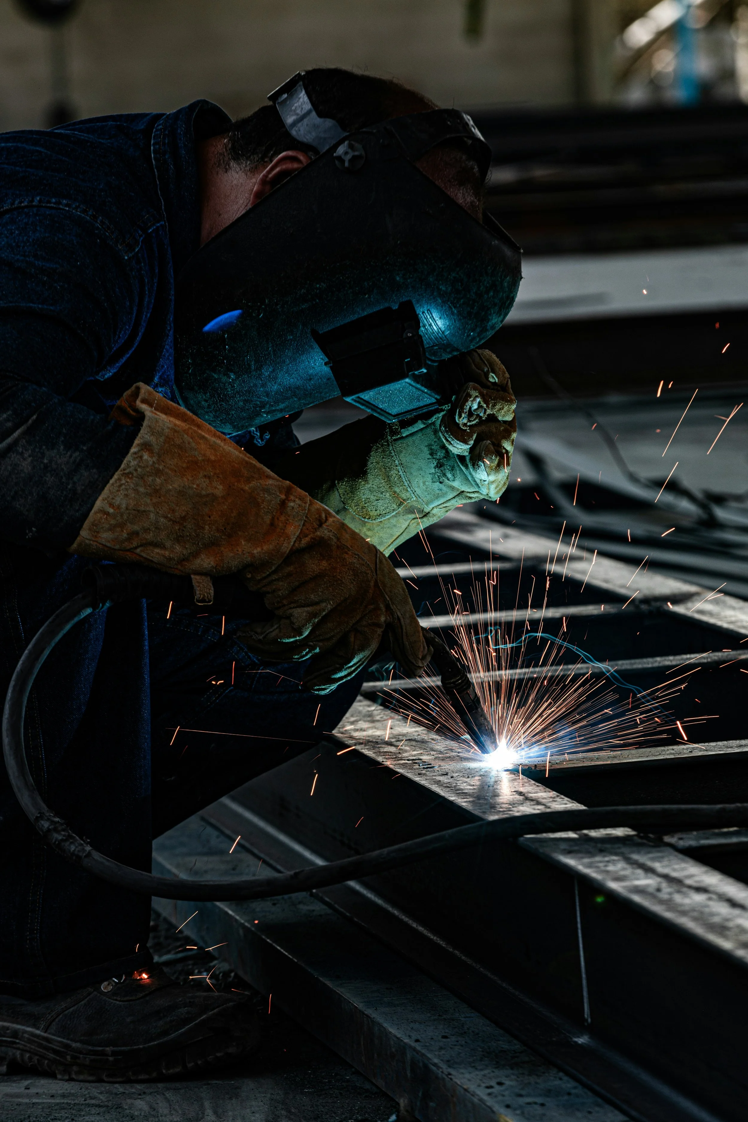 Homepage header image of a welder
