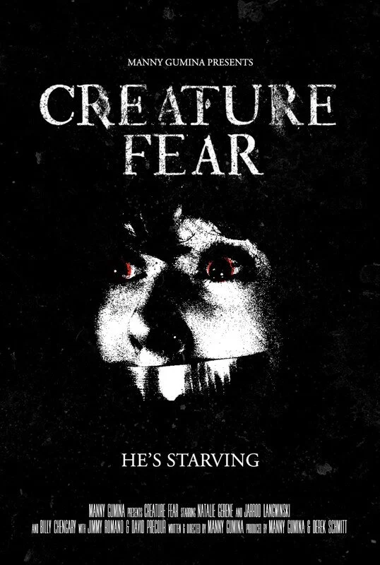 Movie poster for "Creature Fear" featuring a black background with a distorted face, appearing skeletal with red eyes, and the tagline "He's Starving."