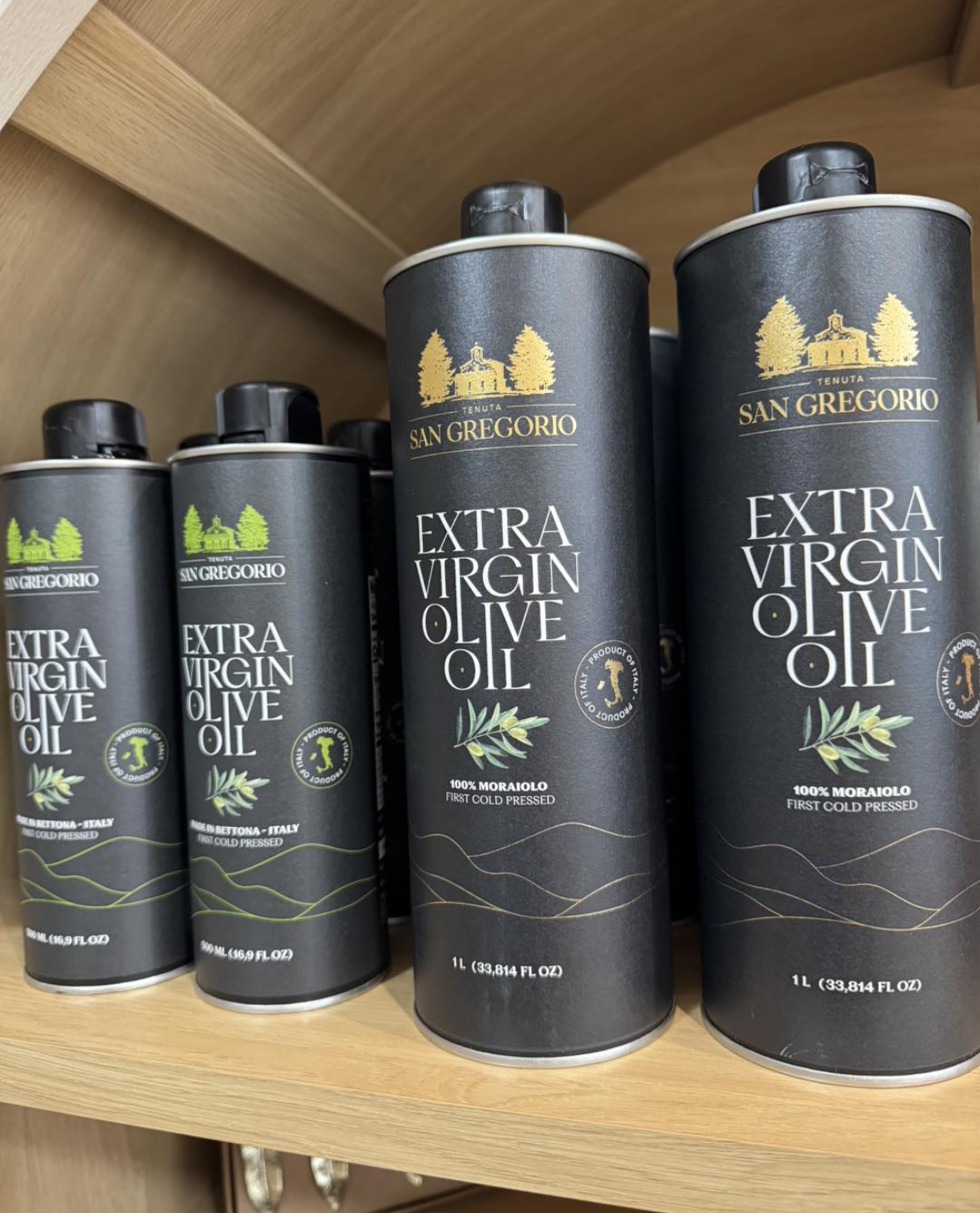 bottle of San Gregorio extra virgin olive oil. Black bottles with a gold label.