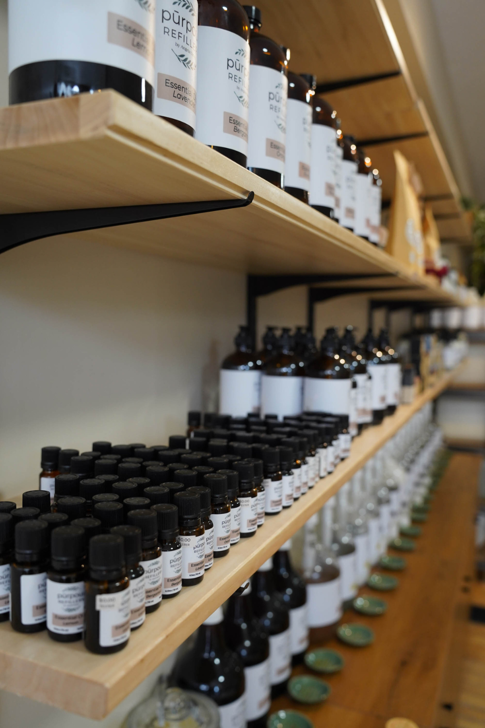 a close up image of our refillable bottles on a shelf