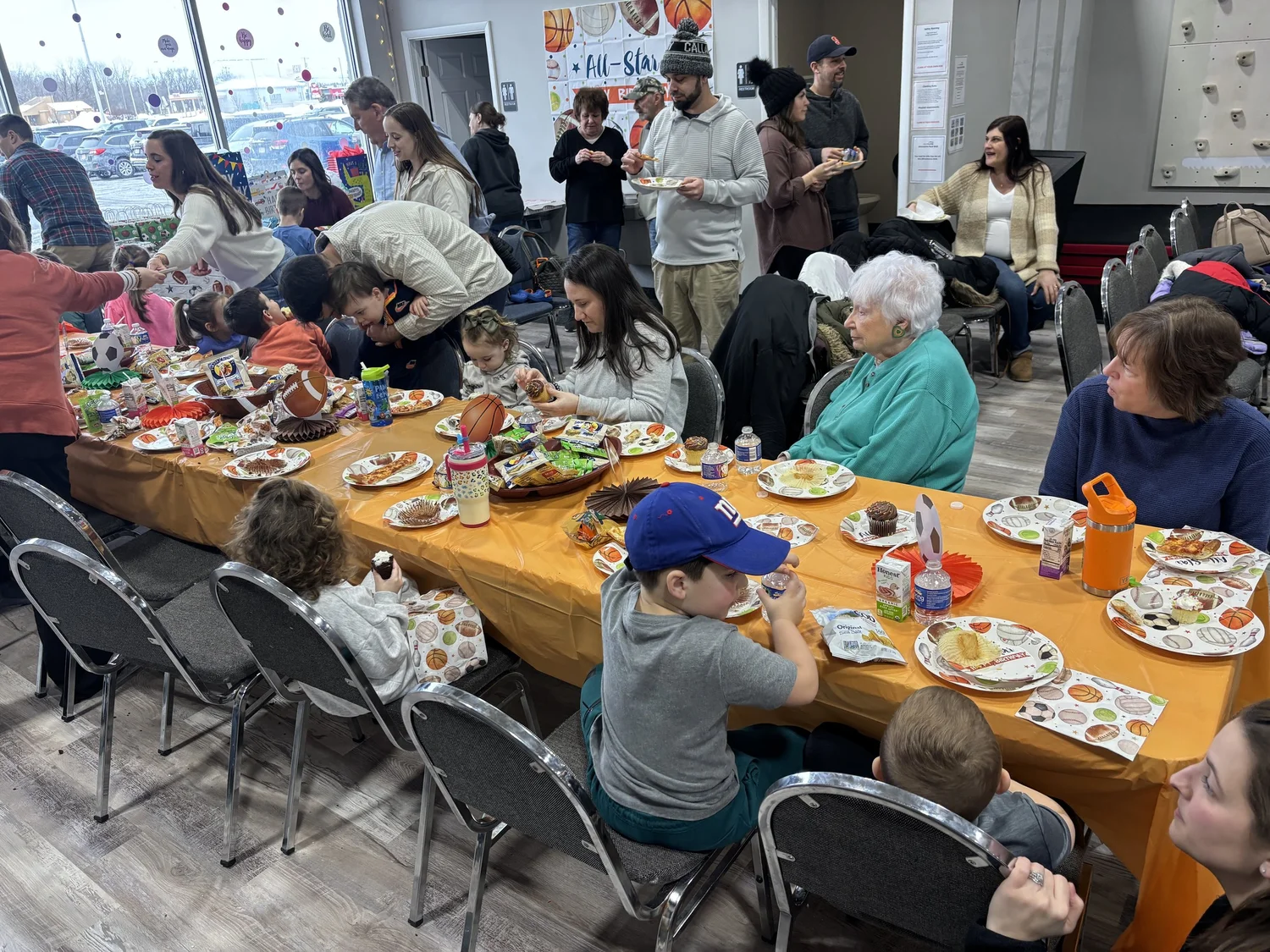Families celebrating together in the Blaze Gymnastics party area