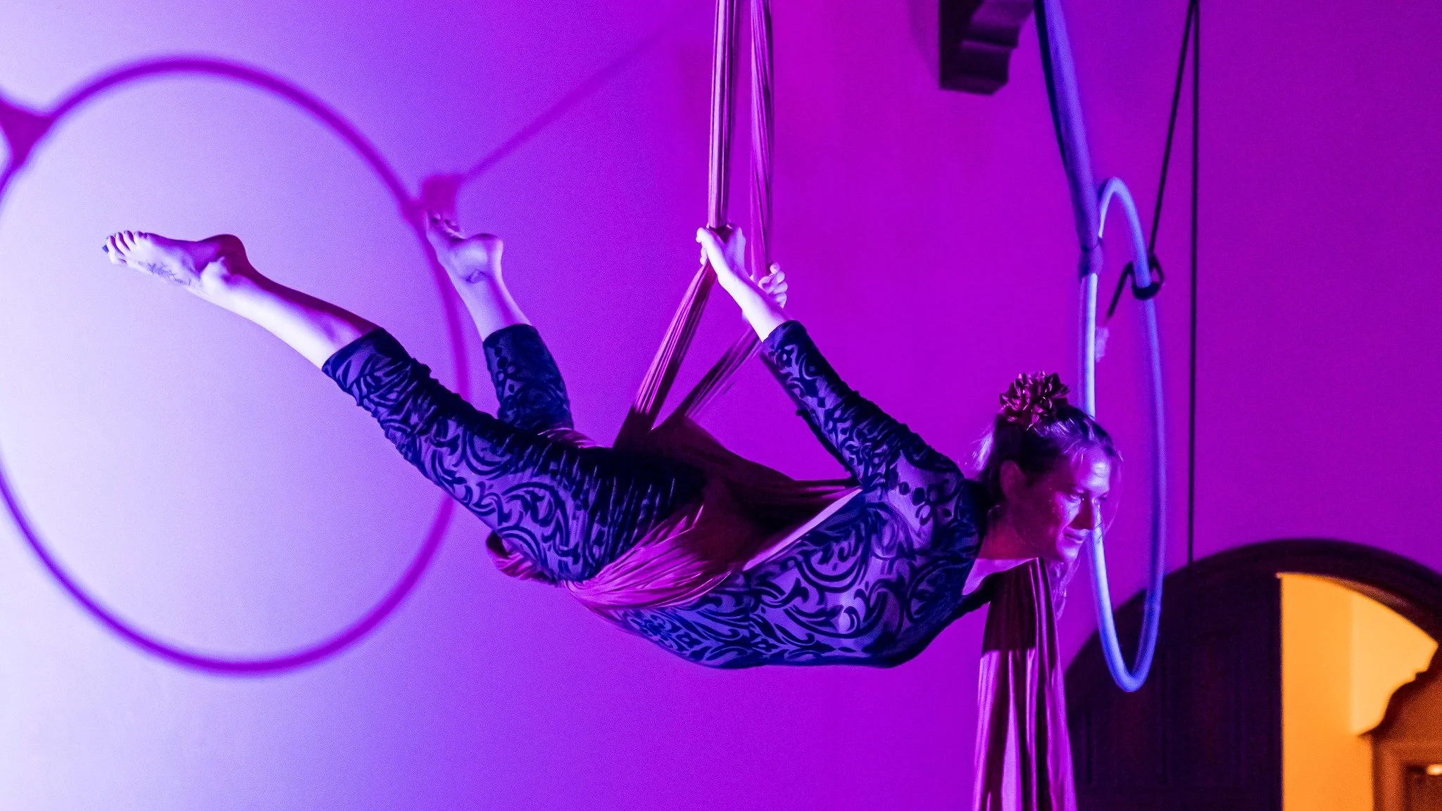 Em of the Dragonettes performing on aerial silks