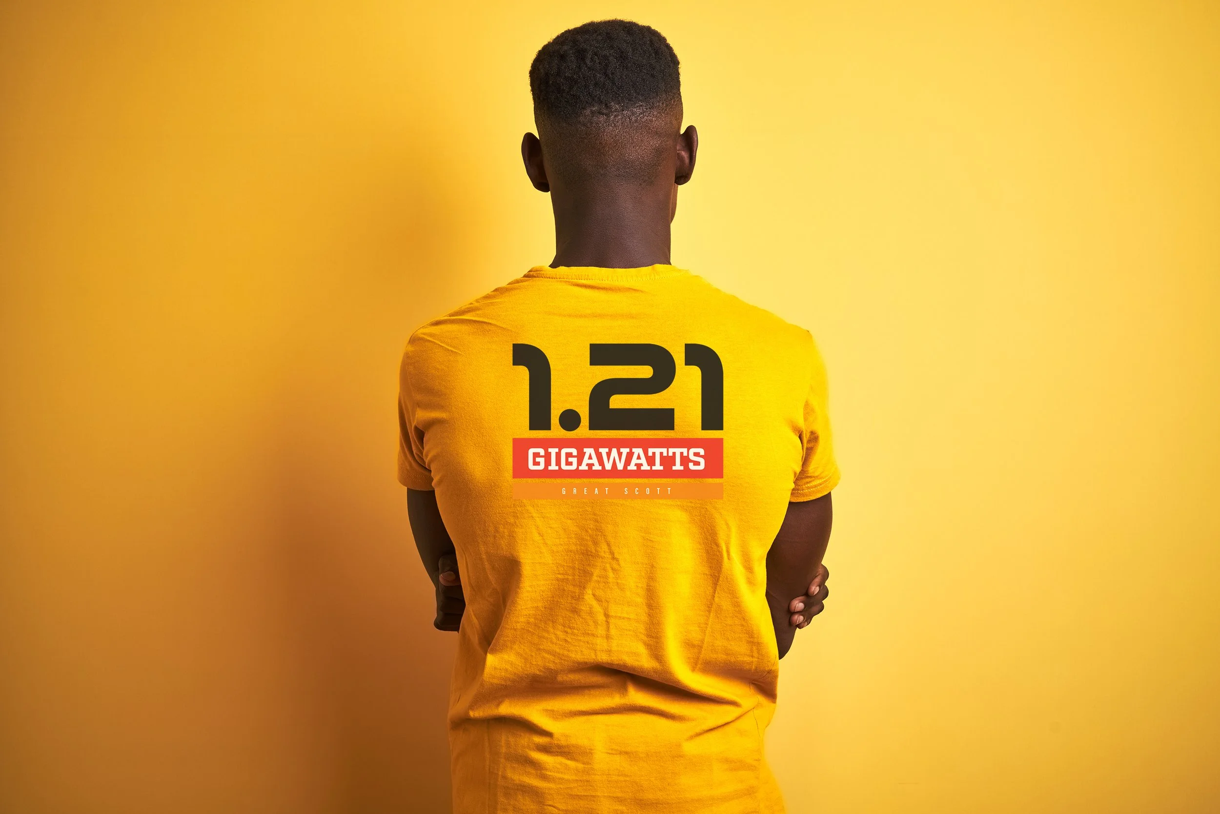 Smiling woman relaxing on a porch with potted plants and greenery in the background.