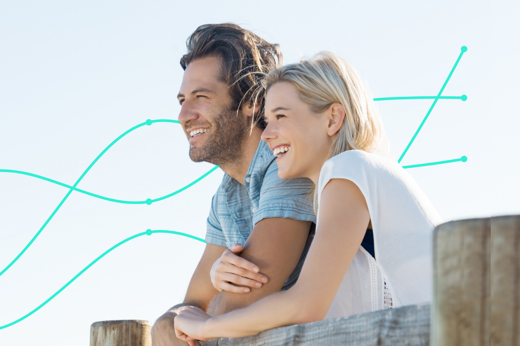 A happy couple looking toward a high-growth future, representing the long-term wealth created through Properly Buyers Agency’s data-driven property market insights.