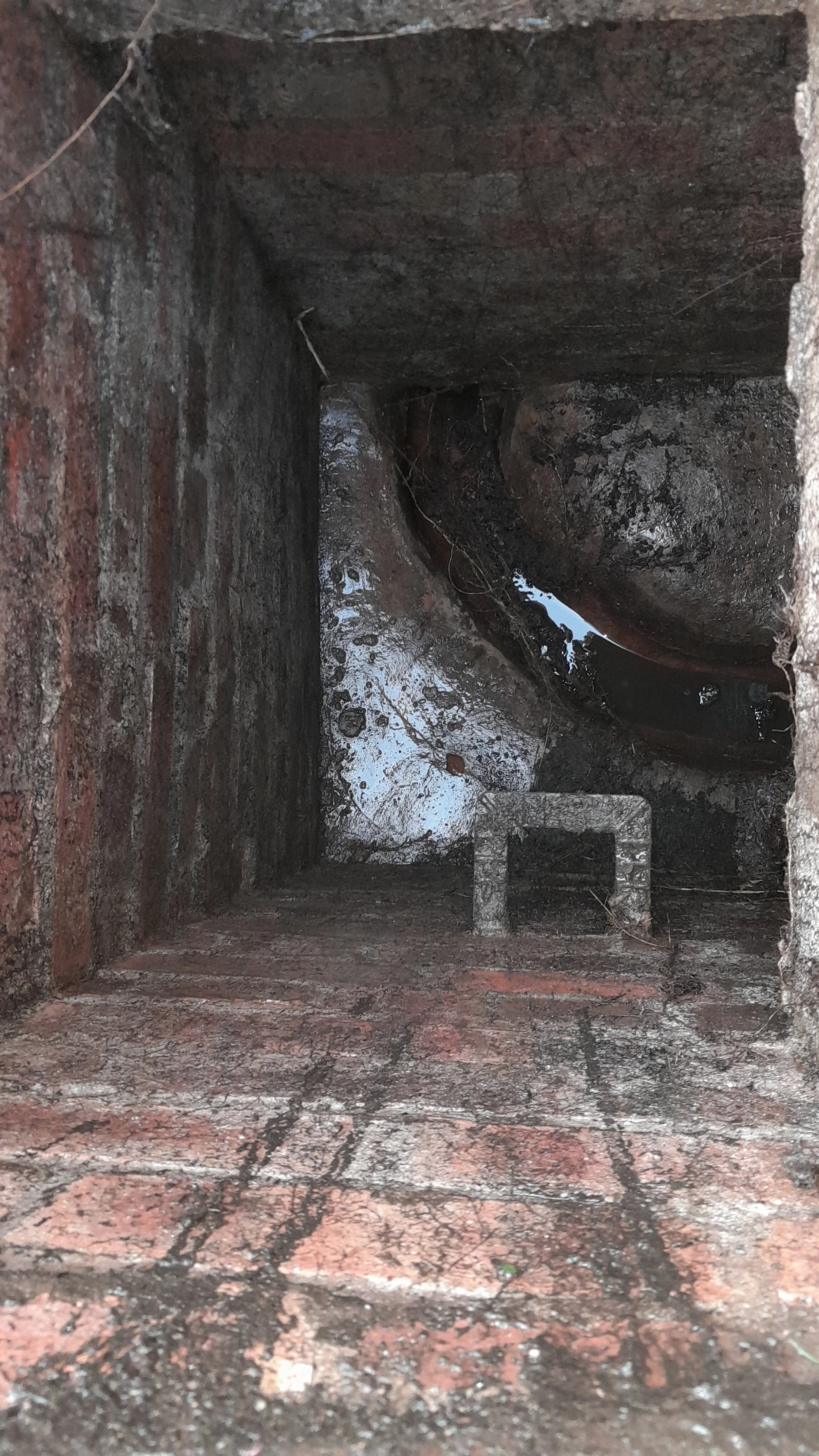 A blocked drain has been cleared following root removal from the manhole.