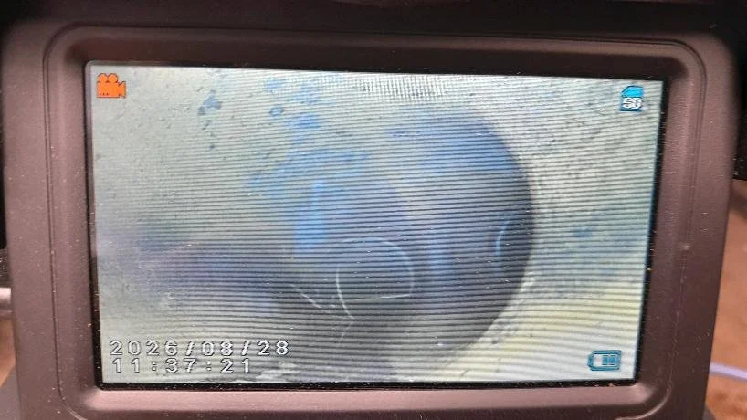 CCTV drain survey has revealed root ingress and a displaced joint downstream of the toilet.