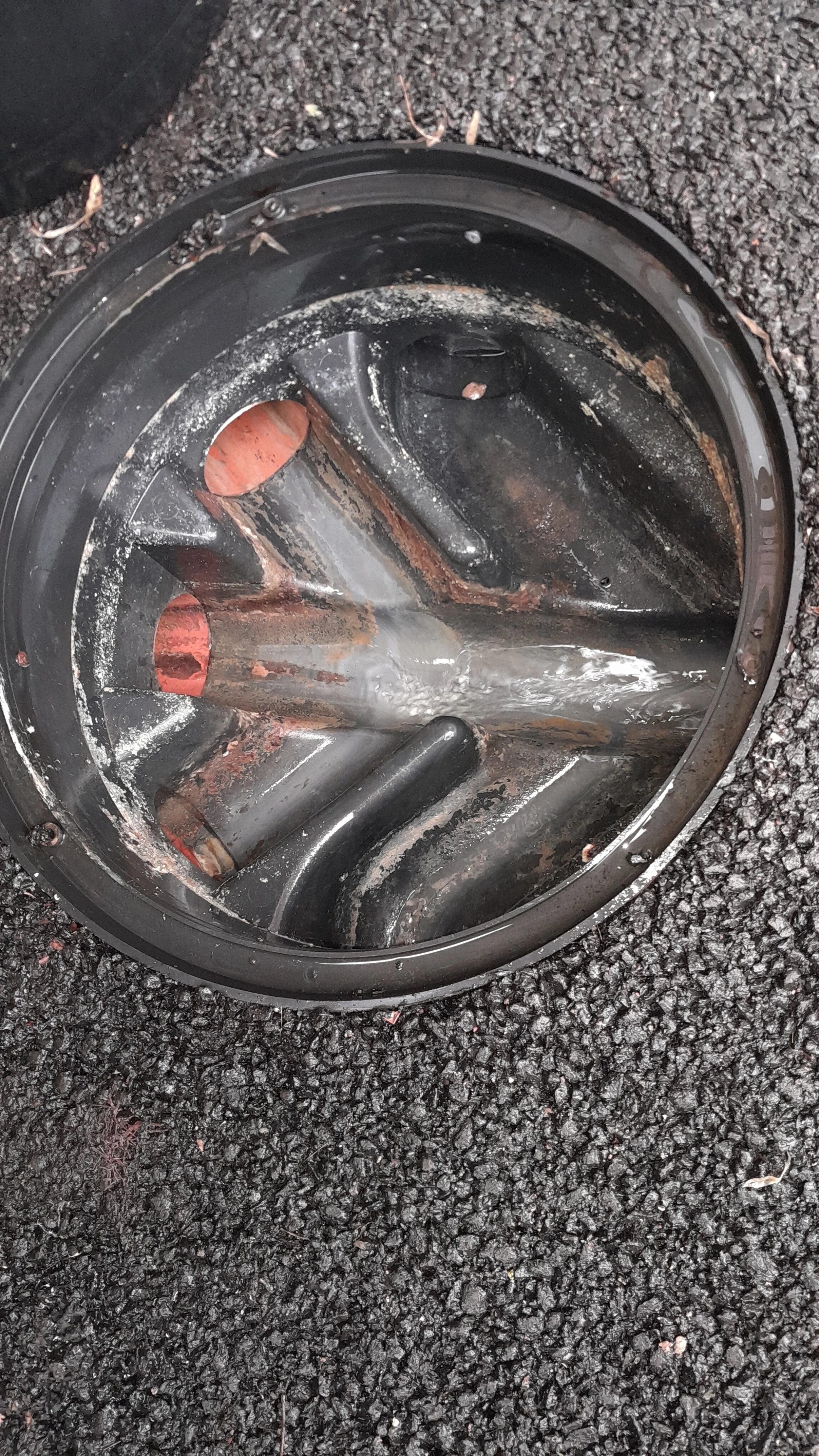 Blocked drains upstream of the manhole have been cleared and checked with a CCTV survey.