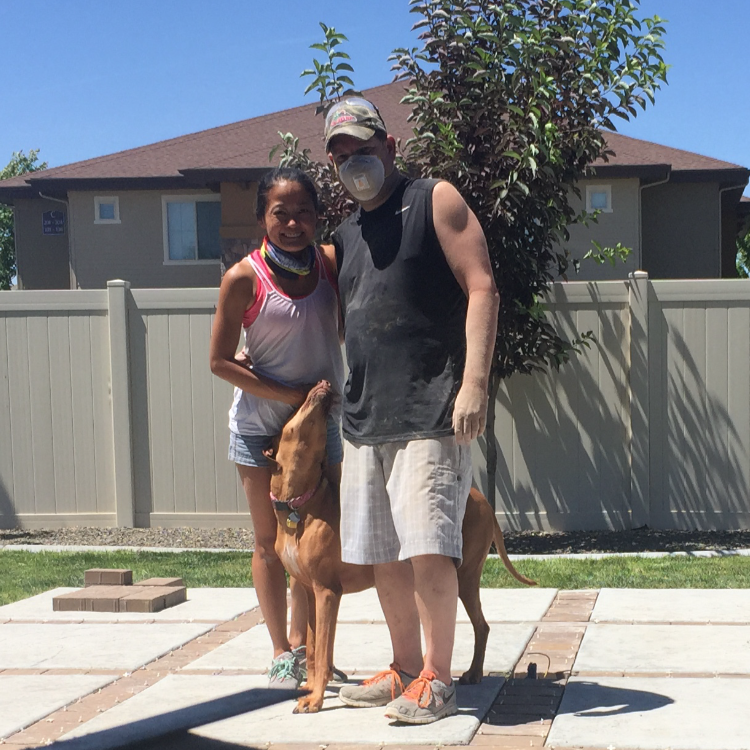 Brent and Mila after completing a residential patio project with a Ridgeback dog.