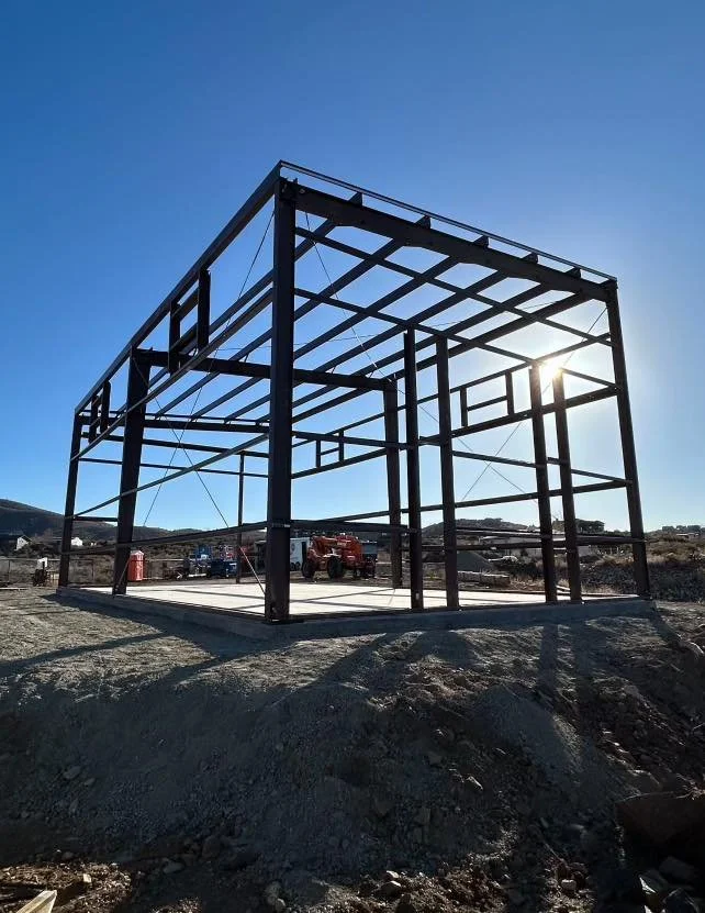 Steel workshop frame under construction on a residential property in Prescott, Arizona.