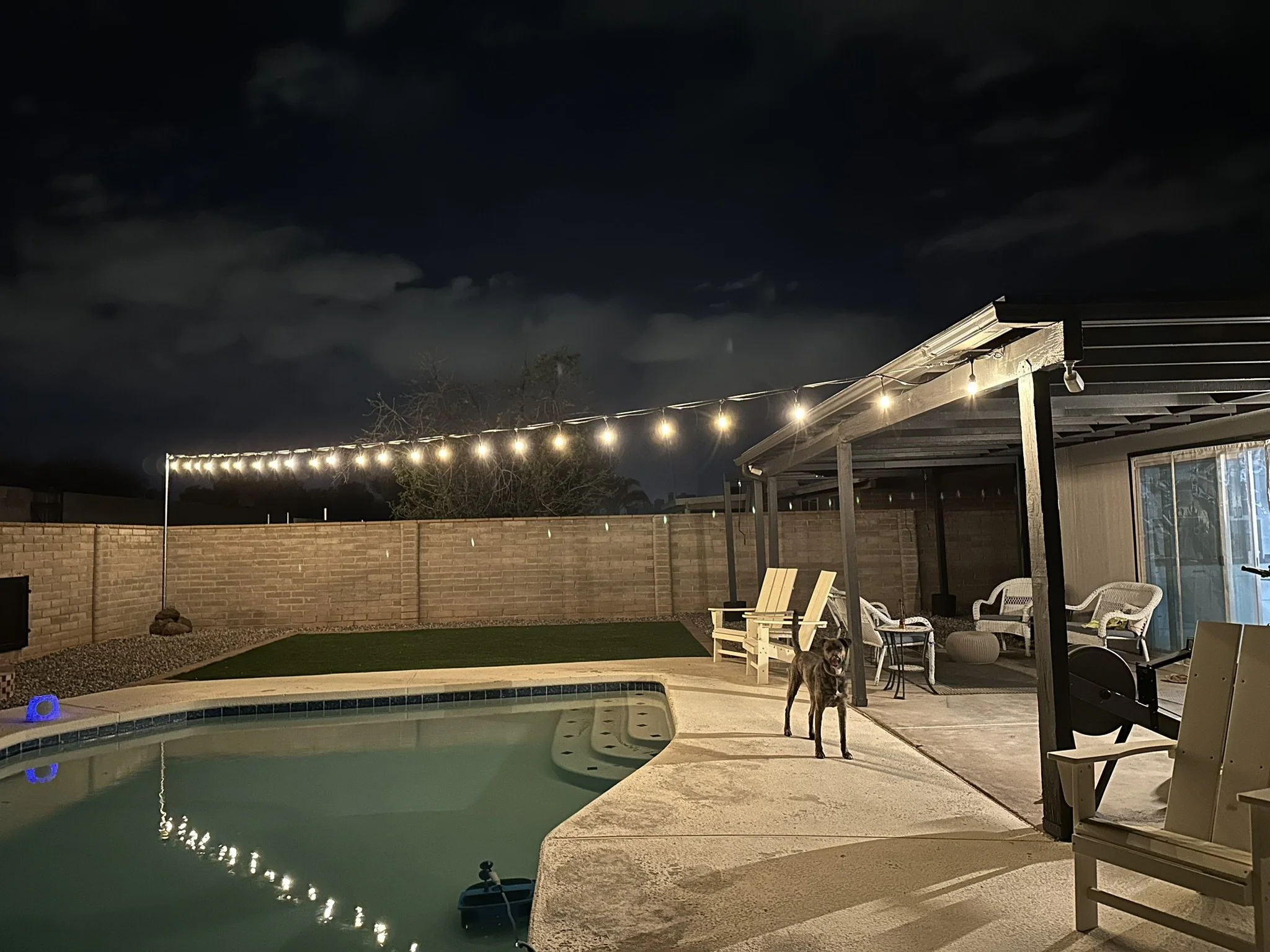 Residential outdoor updates with pool area, string lights, and yard improvements.