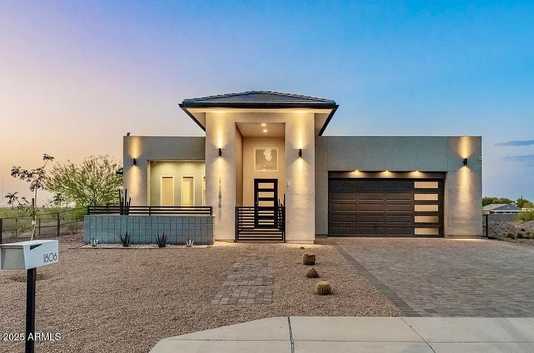 Modern House Completed custom home exterior with modern lighting and driveway improvements.