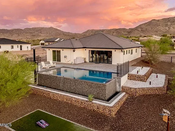 Modern House Pool & Landscaping Backyard pool, gabion walls, turf, and outdoor living improvements.