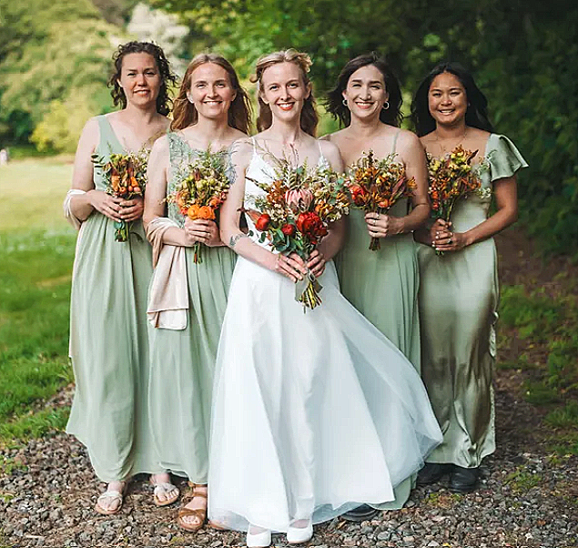 The bride and bridesmaids with their bouquets.