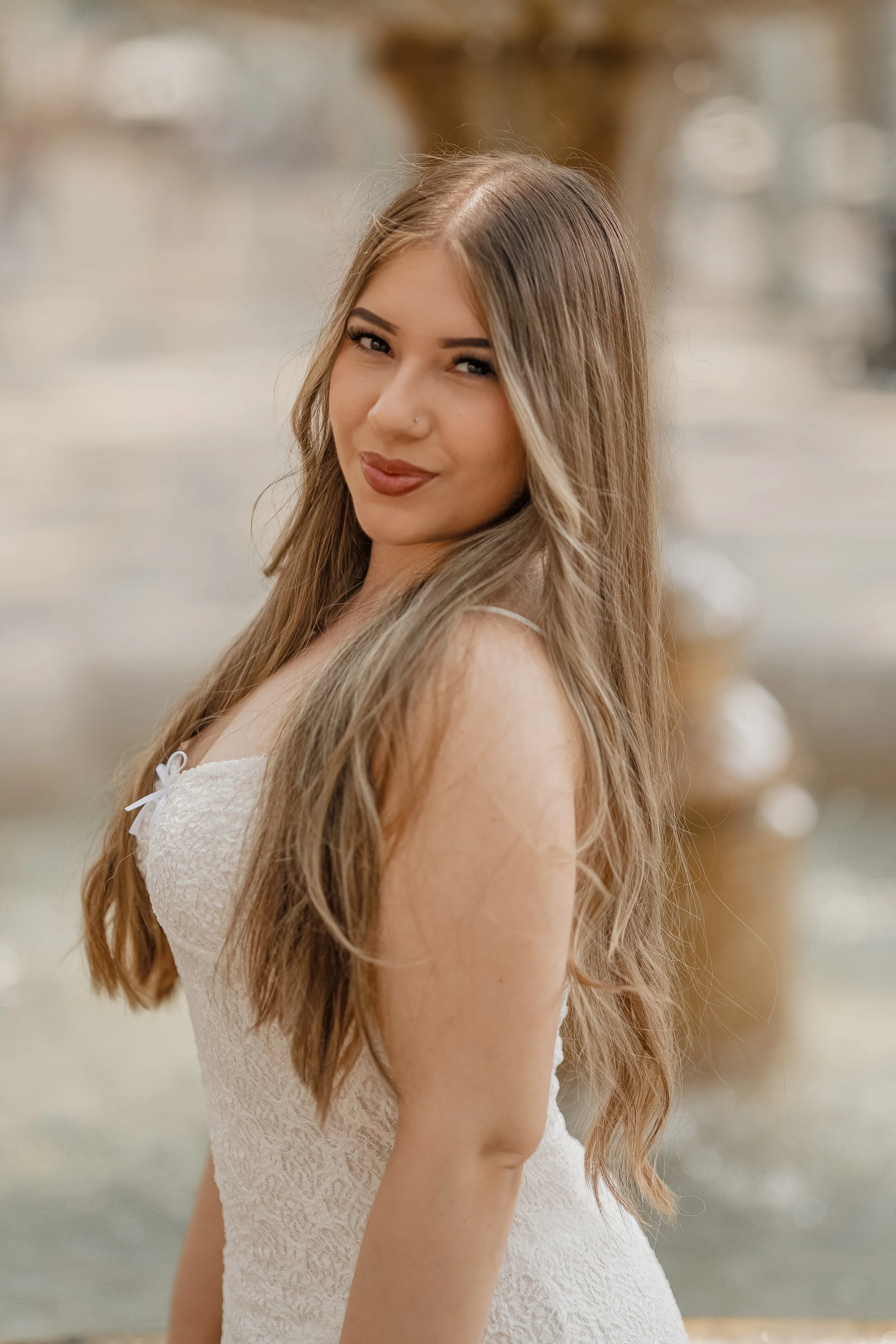 Elegant female portrait in Mallorca, featuring a woman looking directly into the camera during a professional portrait photography session