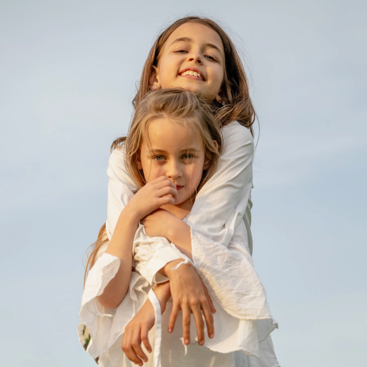 sisters laughing on the beach of Mallorca