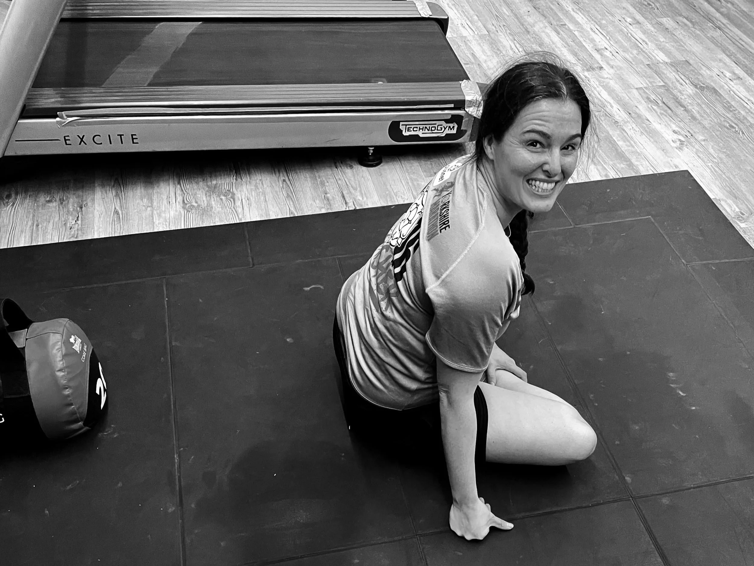 Woman training gym personal trainer session strength training