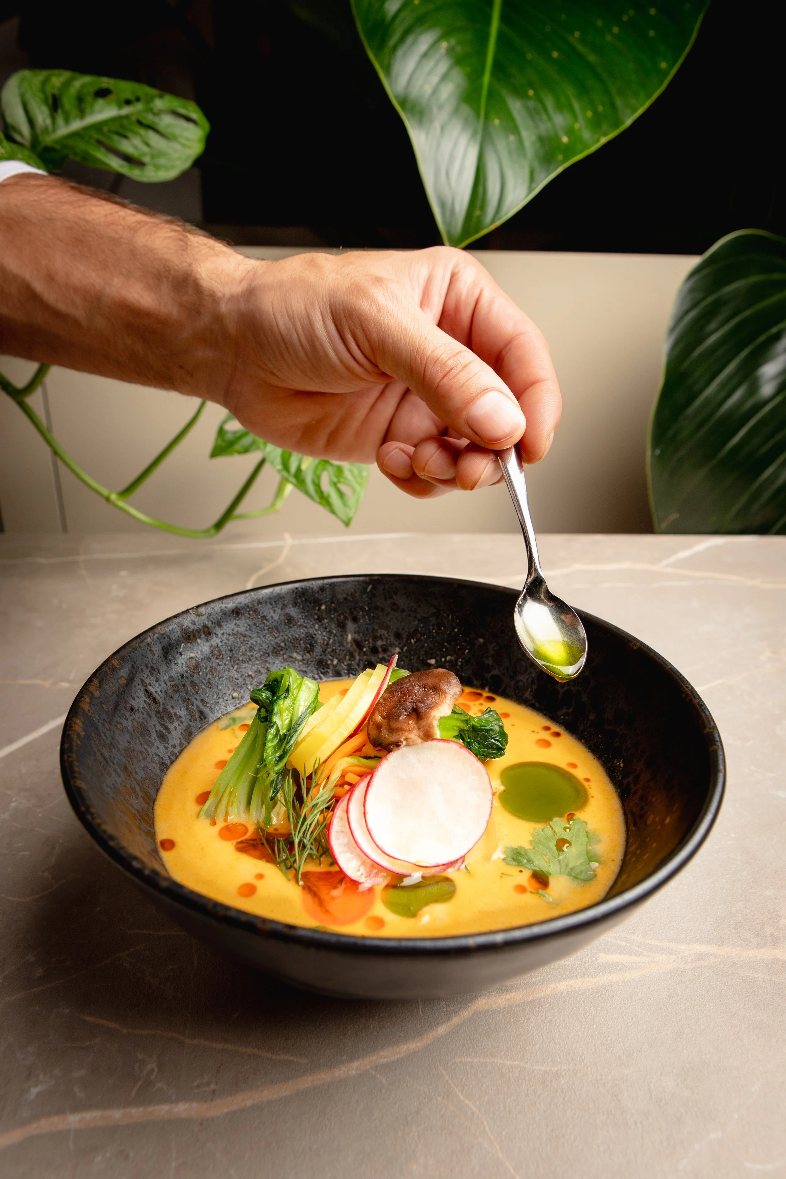 Tom kha soup with coconut milk and ramen nudles.
