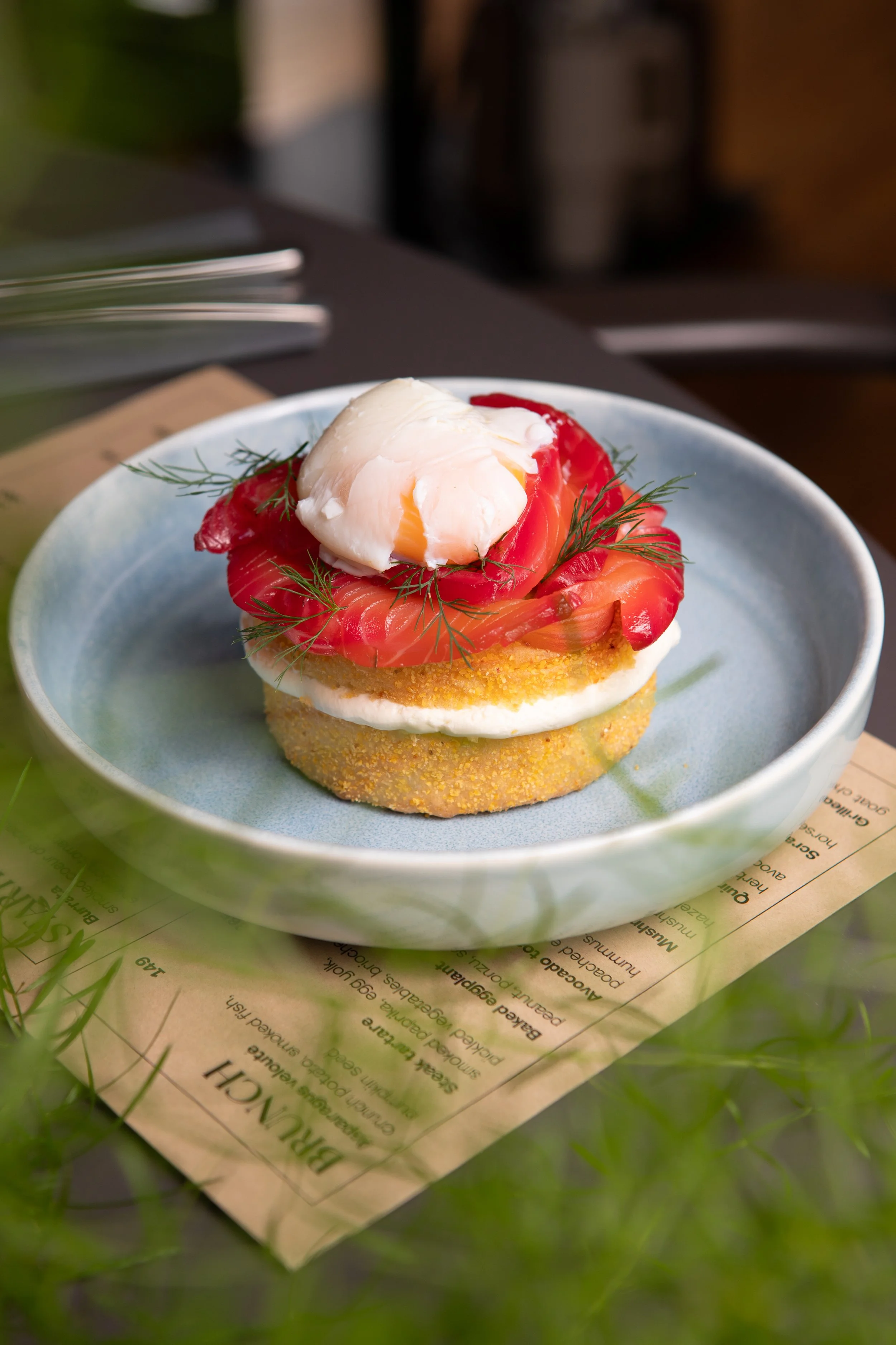 Homemade gluten free muffin with salmon, quinoa, egg 62, avocado cream.