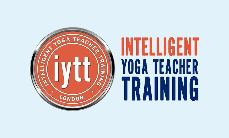 Logo for Intelligent Yoga Teacher Training, with text stating 'iytt' and 'London' inside a circular emblem, and adjacent text reading 'Intelligent Yoga Teacher Training' in orange and blue.