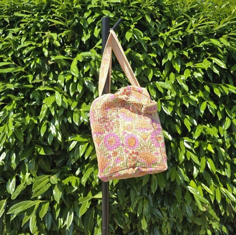 BLOSSOM XL Duffel on peach side.jpg