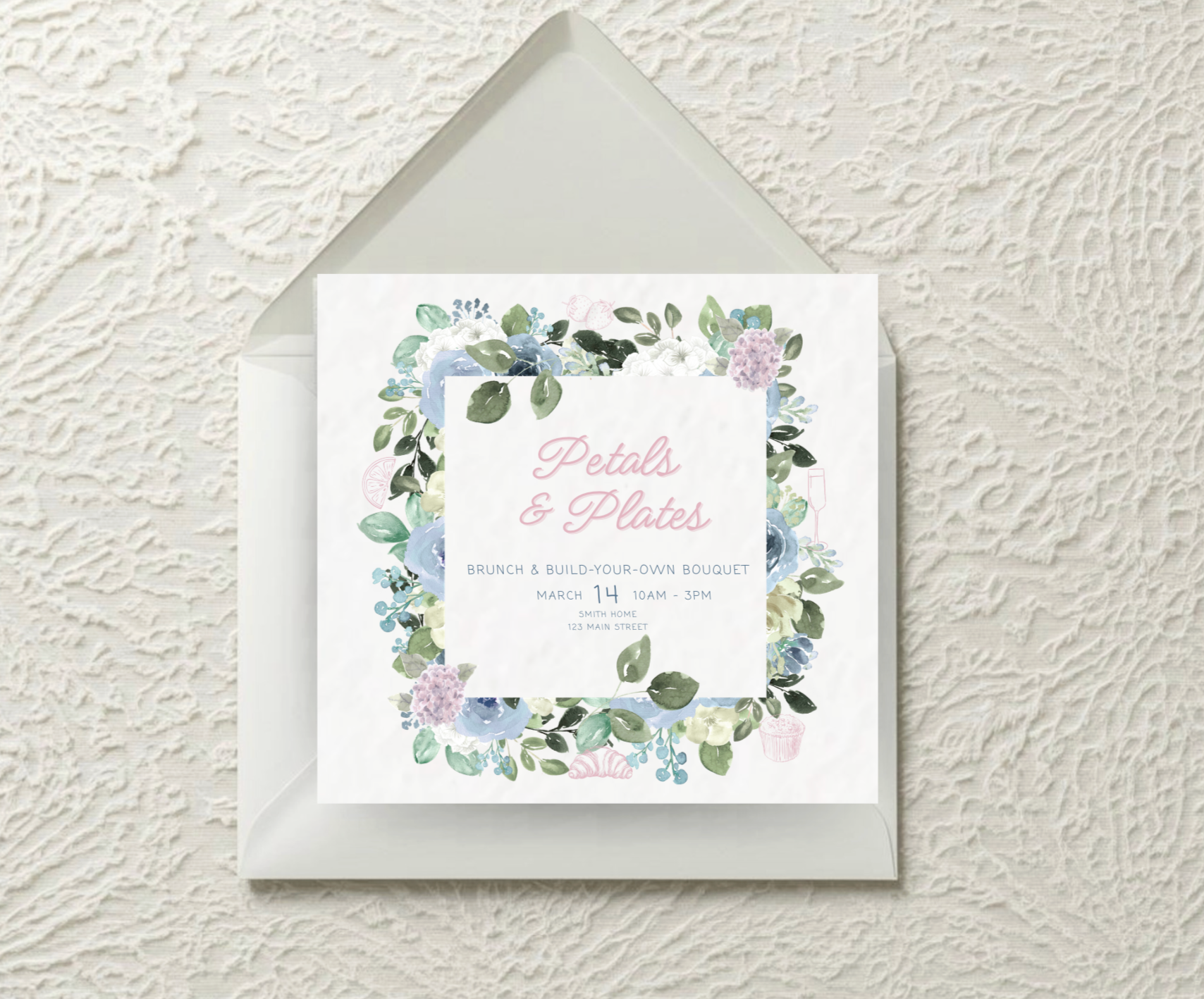 Open cookbook on white kitchen countertop with a cutting board and stove in background